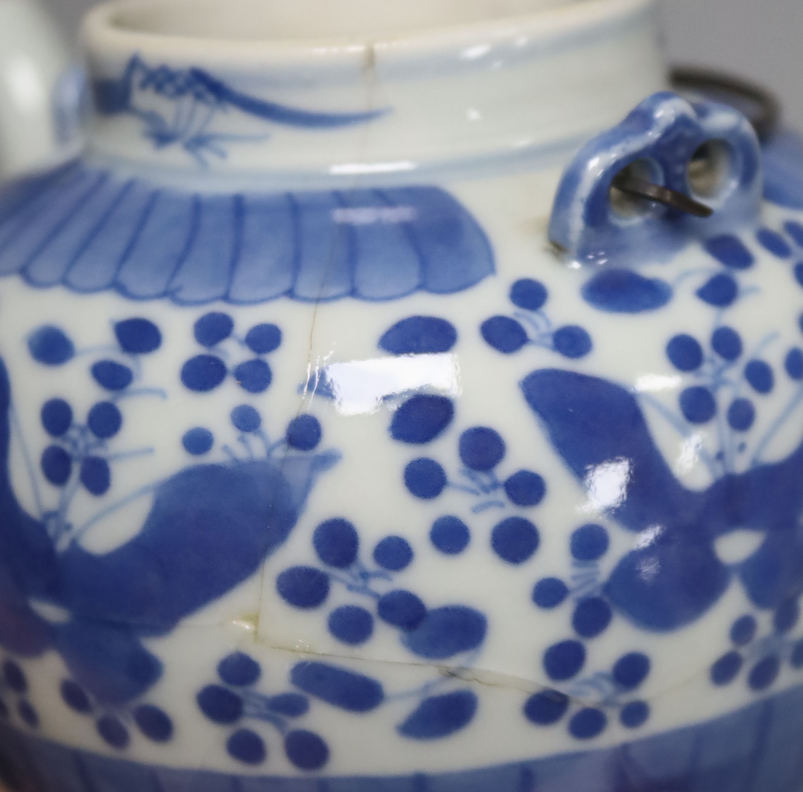 Two 19th century Chinese blue and white moon flasks and a teapot, tallest 21cm